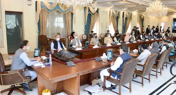 Pakistan's Prime Minister Imran Khan, left, chairs cabinet meeting in Islamabad on May 25, 2021. (Photo courtesy: Prime Minister’s Office)