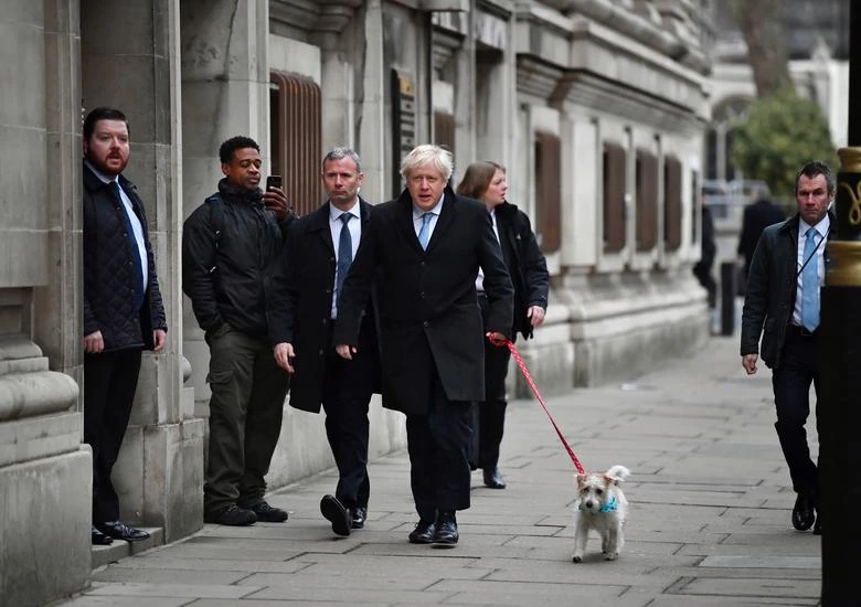 UK PM Boris Johnson walks with his dog Dilyn, London, England, Dec. 12, 2019. (Reuters)