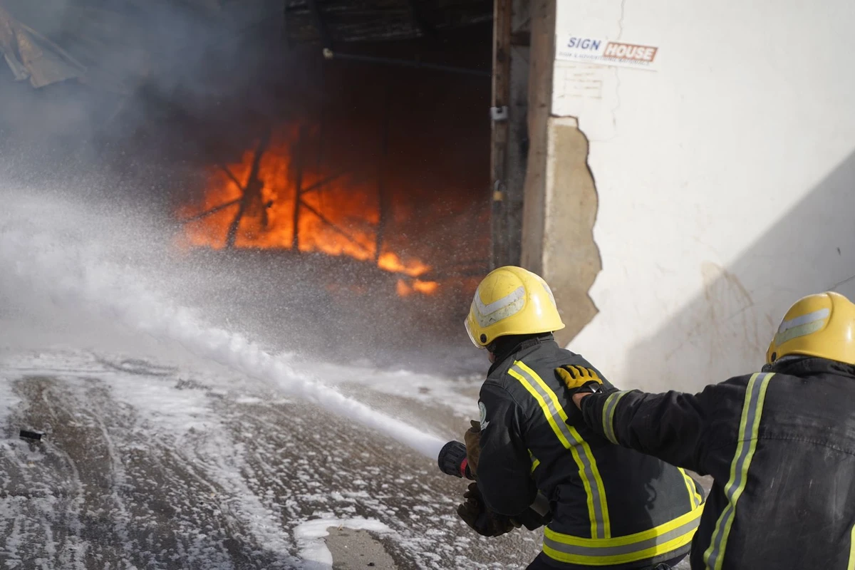 Firefighters work to extinguish a fire at an industrial zone in Riyadh. (@SaudiDCD)