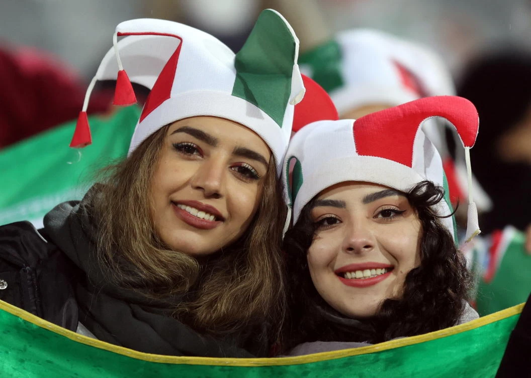 Iranian female fans pose during the 2022 World Cup Asian Qualifiers, Group A, match between Iran and Iraq at Azadi Stadium on Thursday. (Reuters)