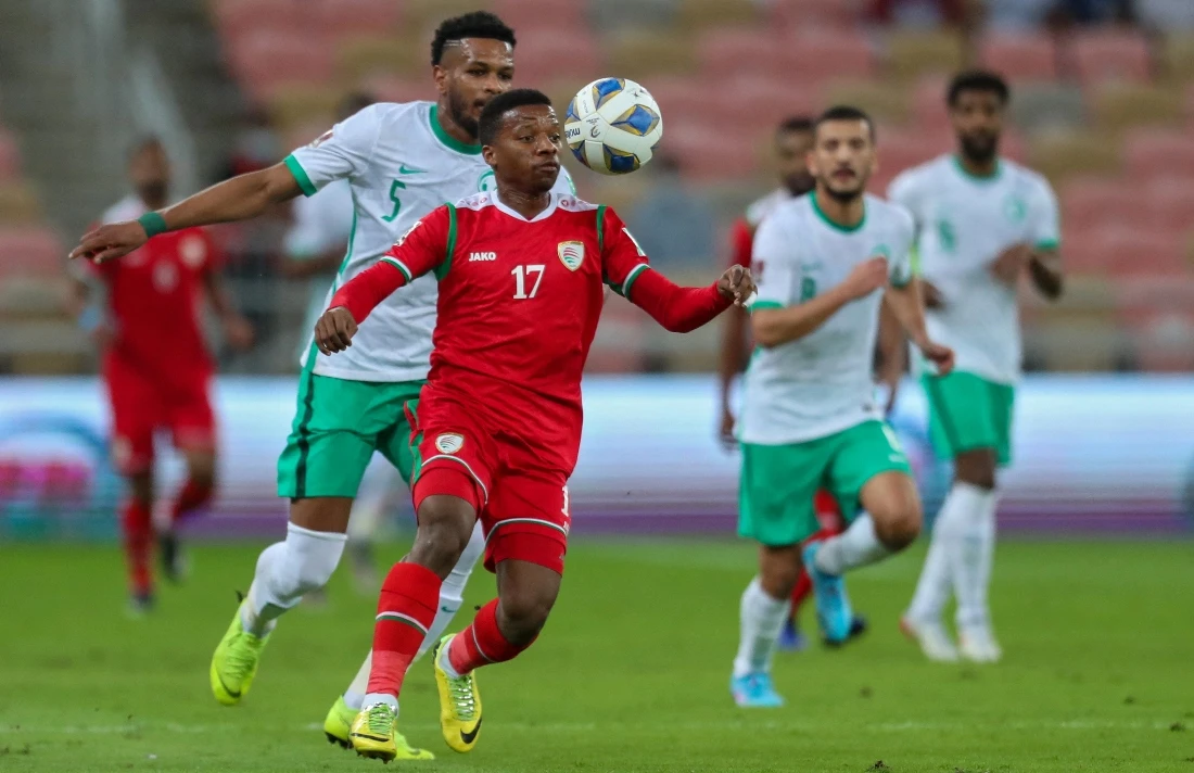 Saudi fans will be celebrating the 1-0 win over Oman that keeps them four points clear at the top of Group B. (AFP)