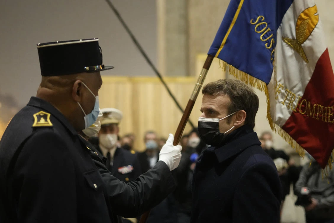Emmanuel Macron attends a ceremony at the Tomb of the Unknown Soldier, under the Arc de Triomphe, to mark International Holocaust Remembrance Day, Paris, France, Jan. 27, 2022. (AP Photo)
