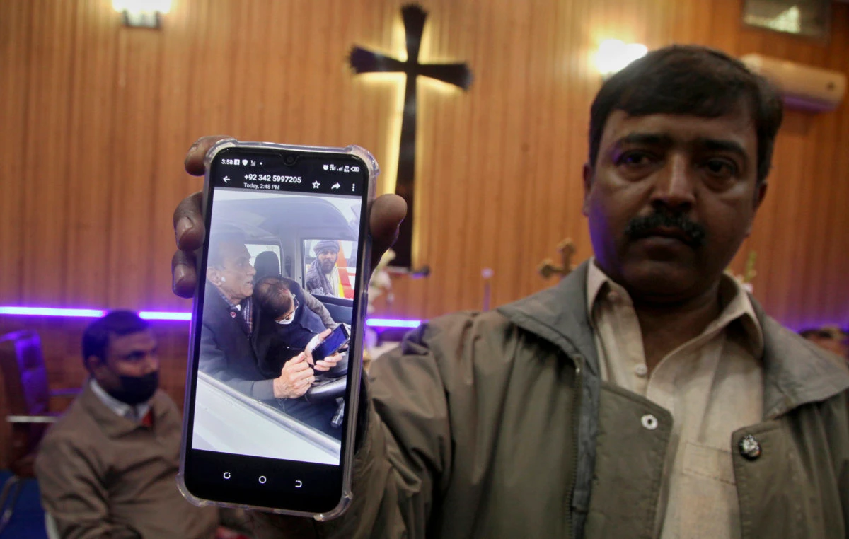 Relatives mourn as Christian priest William Siraj lay dead, killed by unknown gunmen on his way home from church on Jan. 30, 2022. (AP Photo/Muhammad Sajjad)