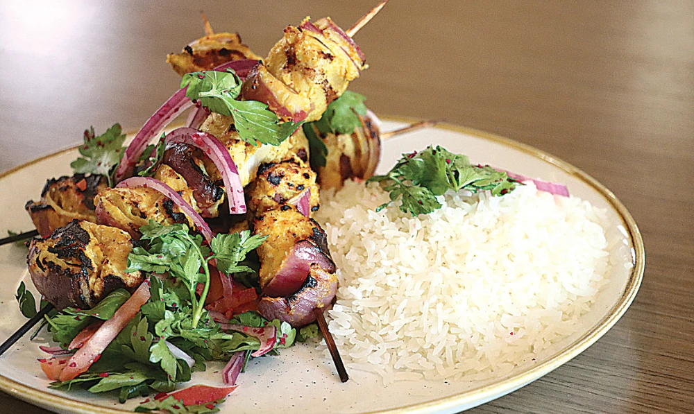 The chicken garlic kabab is served with the choice of white rice and grilled vegetables, at Seven Restaurant. The dish is part of the new menus.