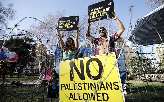 Rights group Amnesty stages a demonstration outside the UK headquarters of US travel company TripAdvisor in London on January 30, 2019. (AFP)