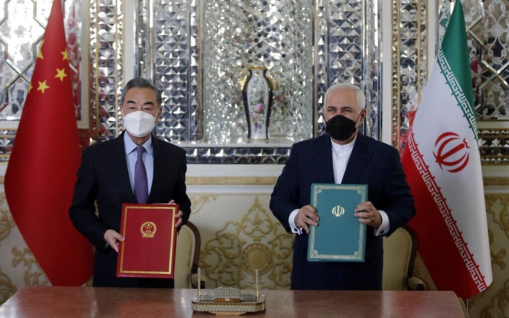 Iranian FM Mohammad Javad Zarif, right, and his Chinese counterpart Wang Yi after signing a strategic agreement, Tehran, Iran, Mar. 27, 2021. (AFP)