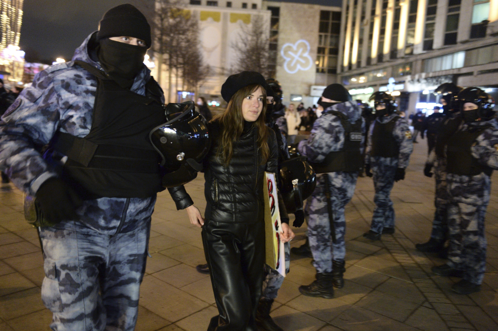 Police detain a demonstrator during an action against Russia's attack on Ukraine in Moscow, Russia, Saturday, Feb. 26, 2022. (AP)
