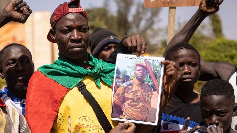 Supporters display a picture of Burkina Faso coup leader Lt-Col Paul-Henri Sandaogo Damiba. (AFP)