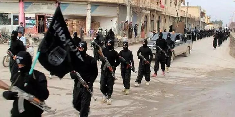 Daesh fighters march in Raqqa, Syria, at the height of the so-called "ISIS caliphate" in 2014. (AP file photo)