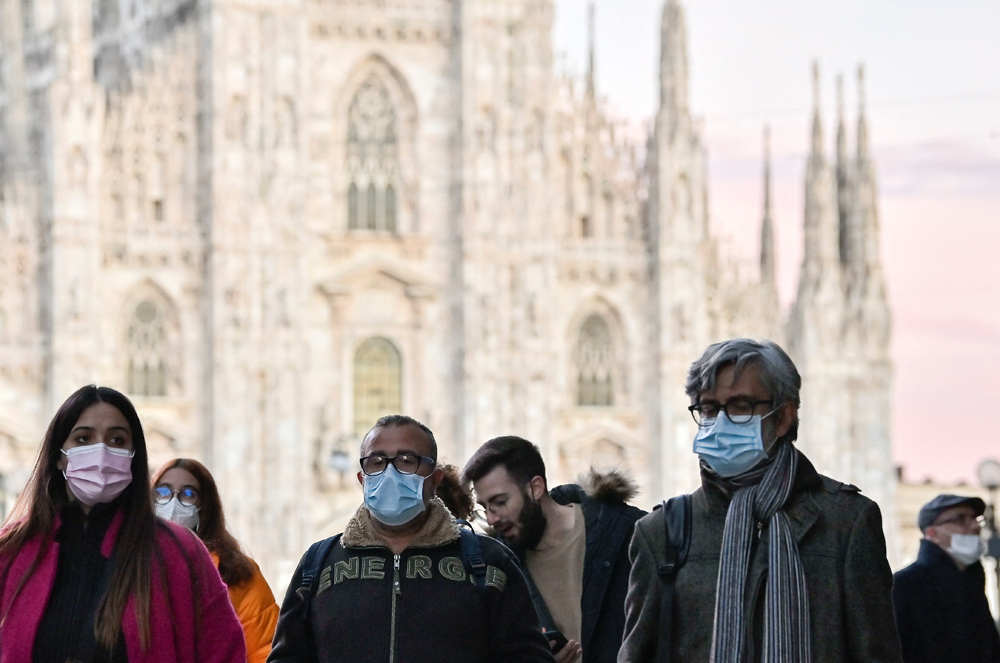 People wear face masks amid the coronavirus disease (COVID-19) pandemic in Milan, Italy, Nov. 28, 2021. (Reuters)