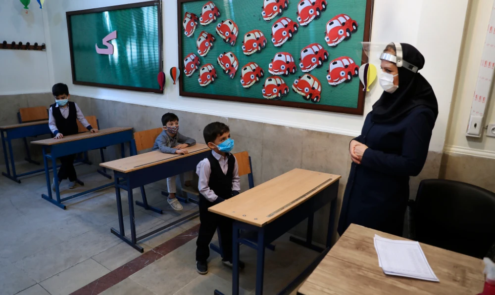 Students and their teacher at the Hashtroudi school in Tehran, Iran. (AP/File)