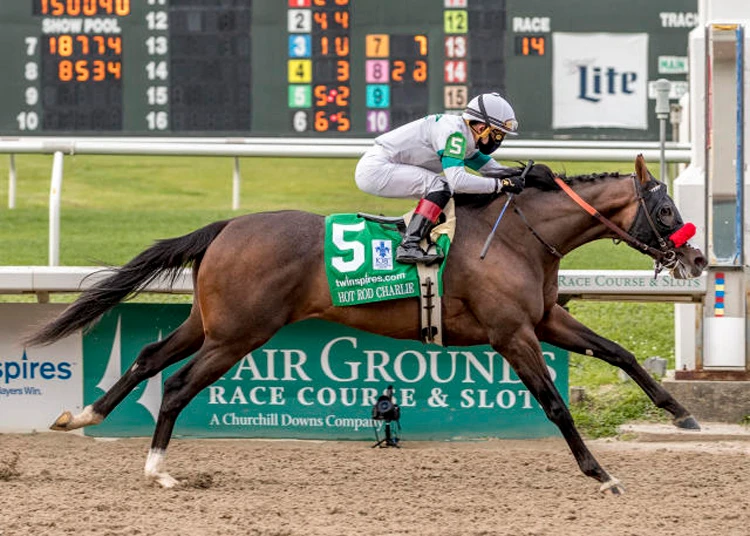 Hot Rod Charlie, with Joel Rosario aboard, wins the 108th running of the $1,000,000 Grade II Louisiana Derby at the Fair Grounds Race Course, New Orleans, U.S., Mar. 20, 2021. (AP Photo)