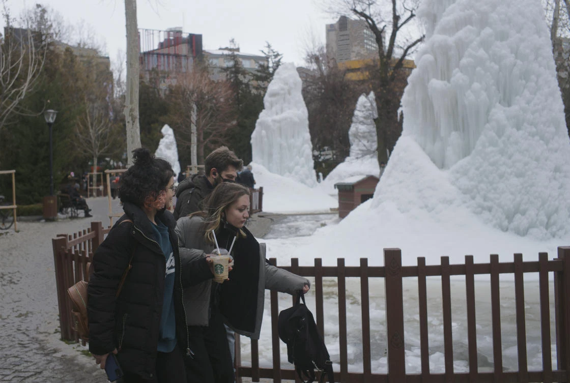 People visit a park on Wednesday in Ankara, in Turkey, where the number of daily infections topped the 100,000 mark. (AP)