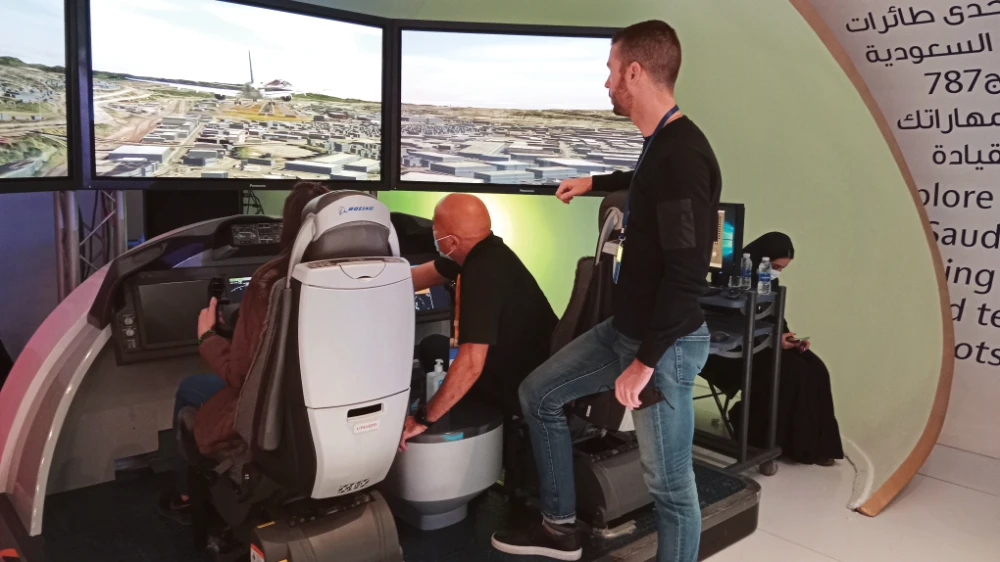Visitors at the E Village in Diriyah explore Saudia’s Boeing 787 simulator. The Saudia 787 features 24 latest-generation full-flat business class seats and a dedicated onboard prayer room.