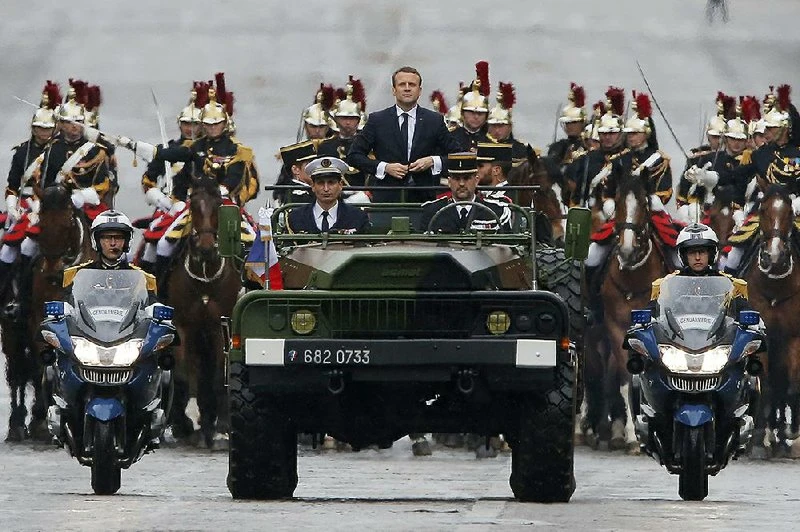 Macron takes aim at migrants in attempt to woo French working class