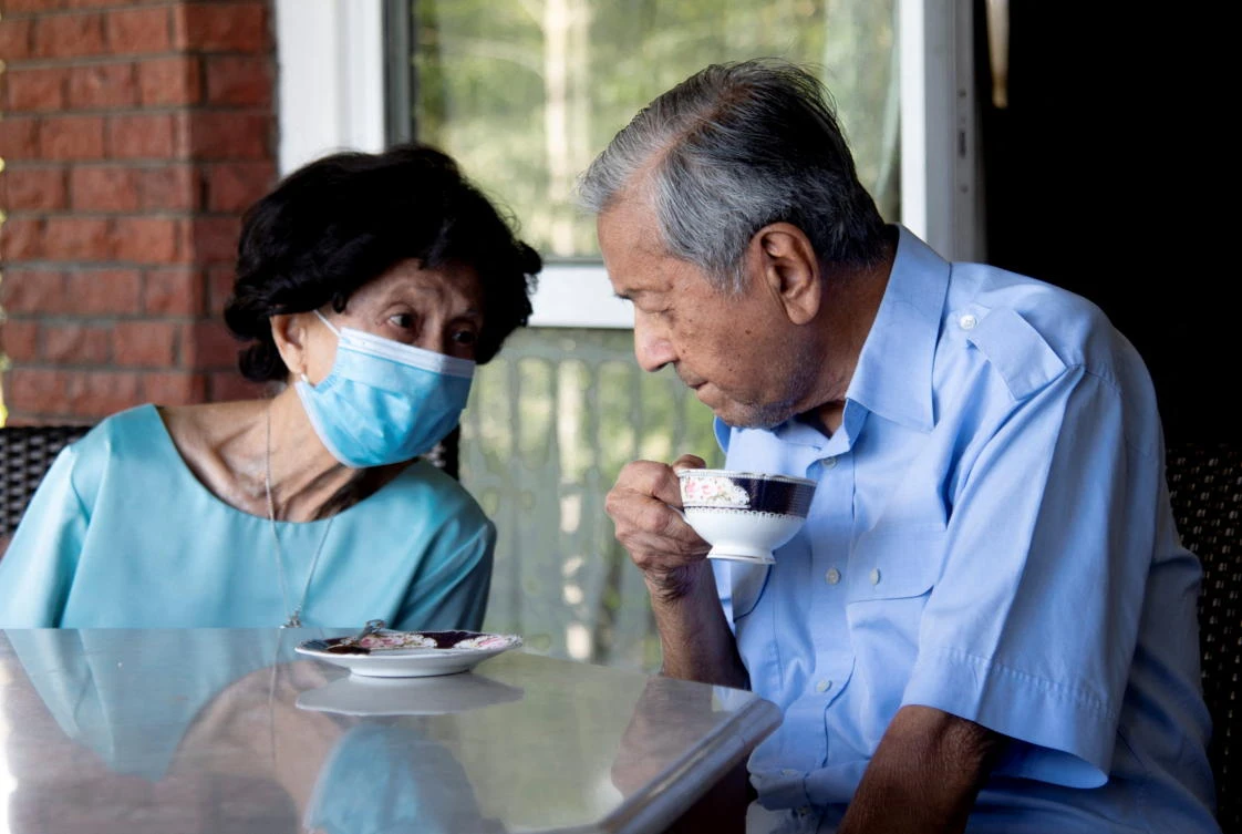 Former Malaysian Prime Minister Mahathir Mohamad and his wife, Siti Hasmah Mohamad Ali spend time at their residence in Seri Kembangan, Selangor, February 4, 2022. (Reuters)