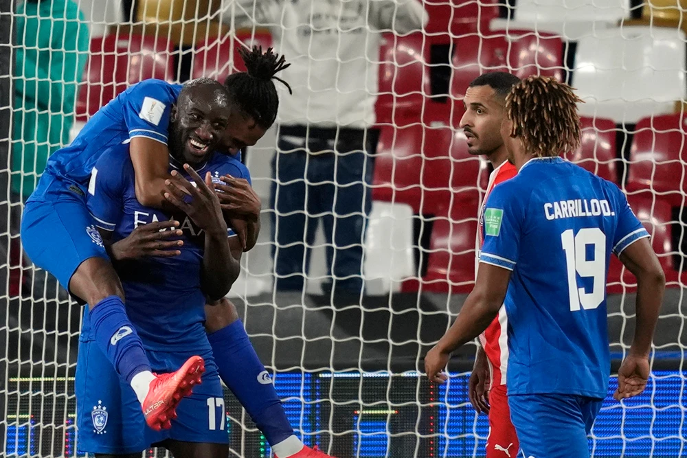 Al-Hilal’s Moussa Marega, 2nd left, celebrates after scoring his side’s fifth goal in the Club World Cup match against Al-Jazira, Mohammed Bin Zayed Stadium, Abu Dhabi, UAE, Feb. 6, 2022. (AP Photo)