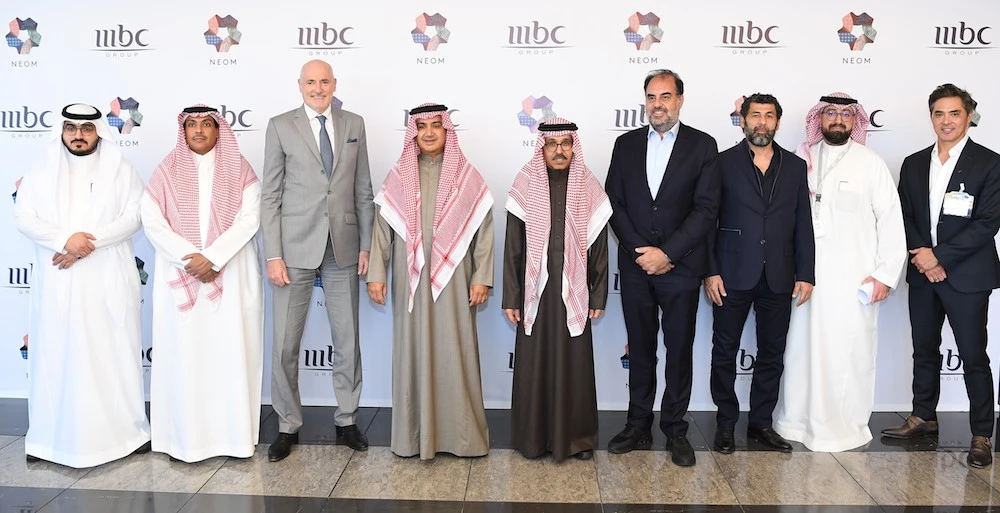 The agreement being signed by representatives from NEOM and MBC Group (Supplied/NEOM)