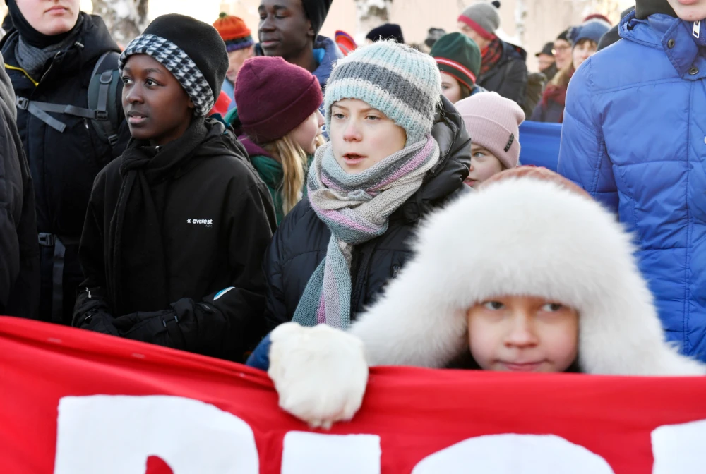 Swedish climate activist Greta Thunberg, center, takes part in a climate strike with Sami children in Jokkmokk, Sweden, Feb. 7, 2020. (AP)