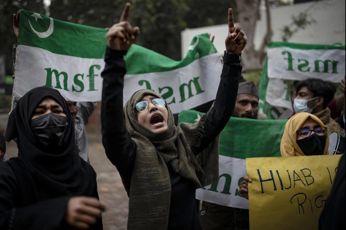 An Indian Muslim woman shouts slogans during a protest against barring Muslim girls wearing hijab from attending classes at some schools in the southern Indian state of Karnataka, in New Delhi, India, Tuesday, Feb. 8, 2022. (AP)