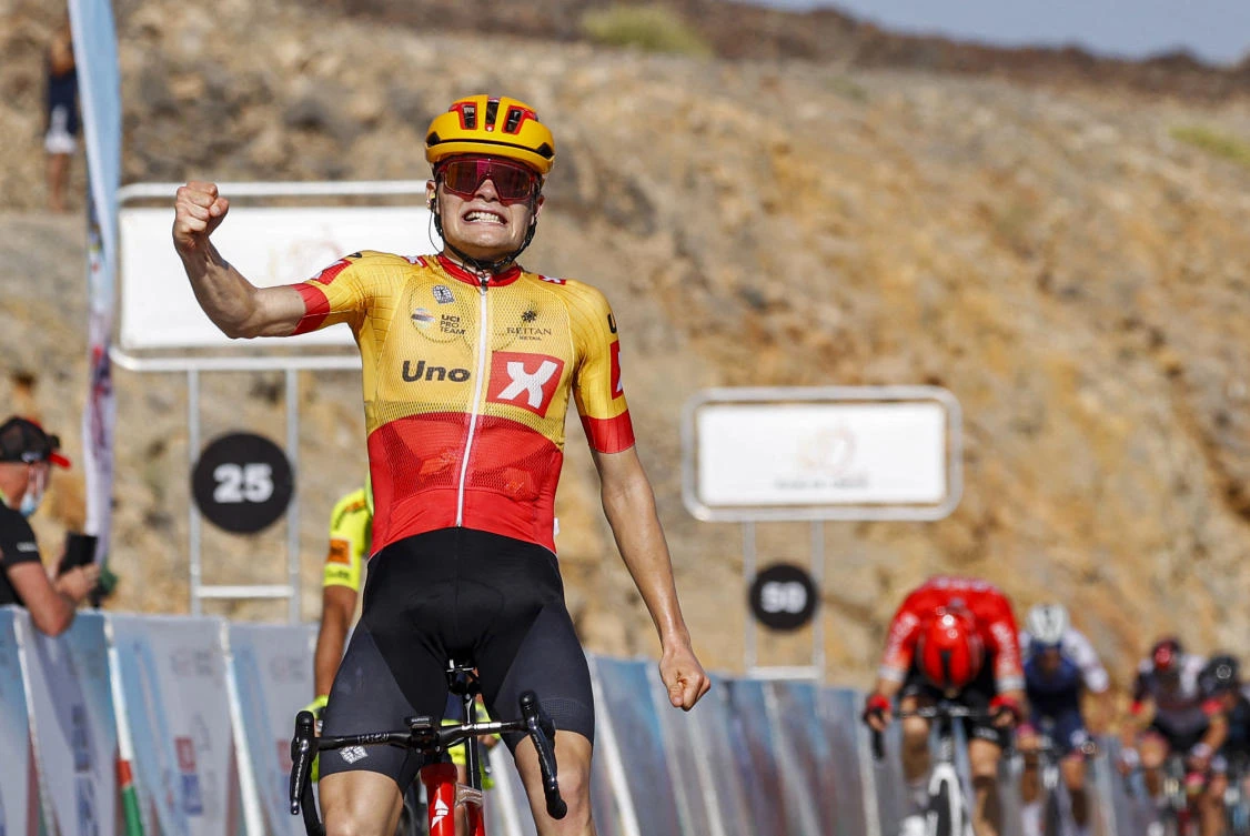 Uno-x Pro Cycling team’s rider Anthon Charmig reacts as he wins the third stage of the 2022 cycling Tour of Oman between Sultan Qaboos University and Qurayyat on Saturday. (AFP)
