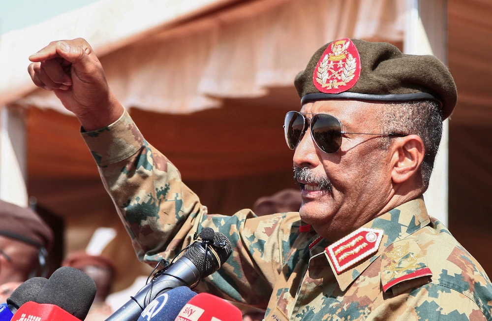 Sudan’s top general Abdel Fattah Al-Burhan speaks as he attends the conclusion of a military exercise in the Maaqil area in the northern Nile River State. (File/AFP)