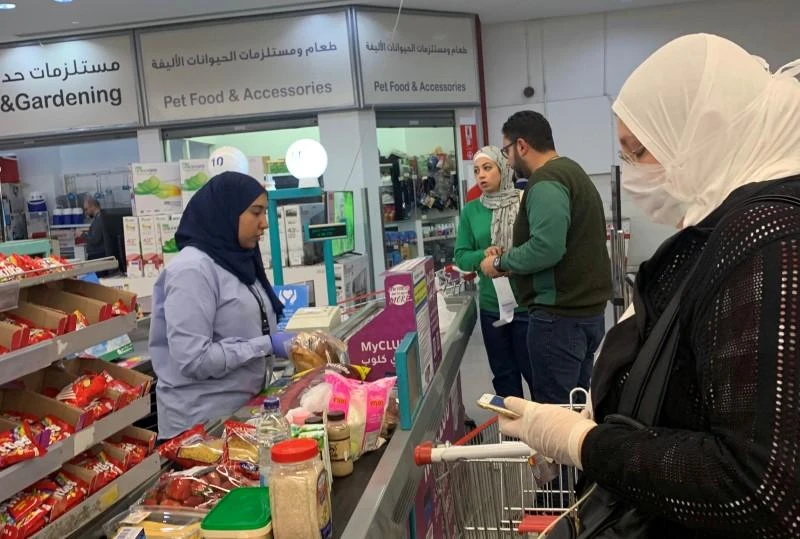 Woman wears a face mask while shopping at Carrefour in Egypt. (Reuters)