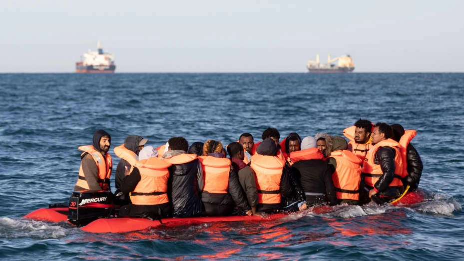Migrants, packed tightly onto a small inflatable boat, attempt to cross the English Channel, near the Dover Strait, the world’s busiest shipping lane, Sept. 07, 2020. (Getty Images)