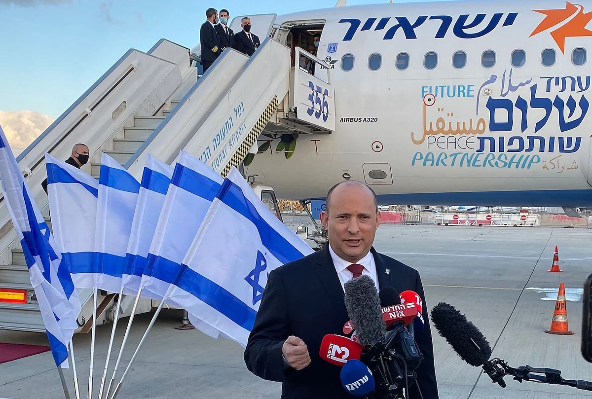 Israeli Prime Minister Naftali Bennett delivers a speech upon his departure to Bahrain on February 14, 2022 at Ben Gurion Airport near Tel Aviv. (AFP)