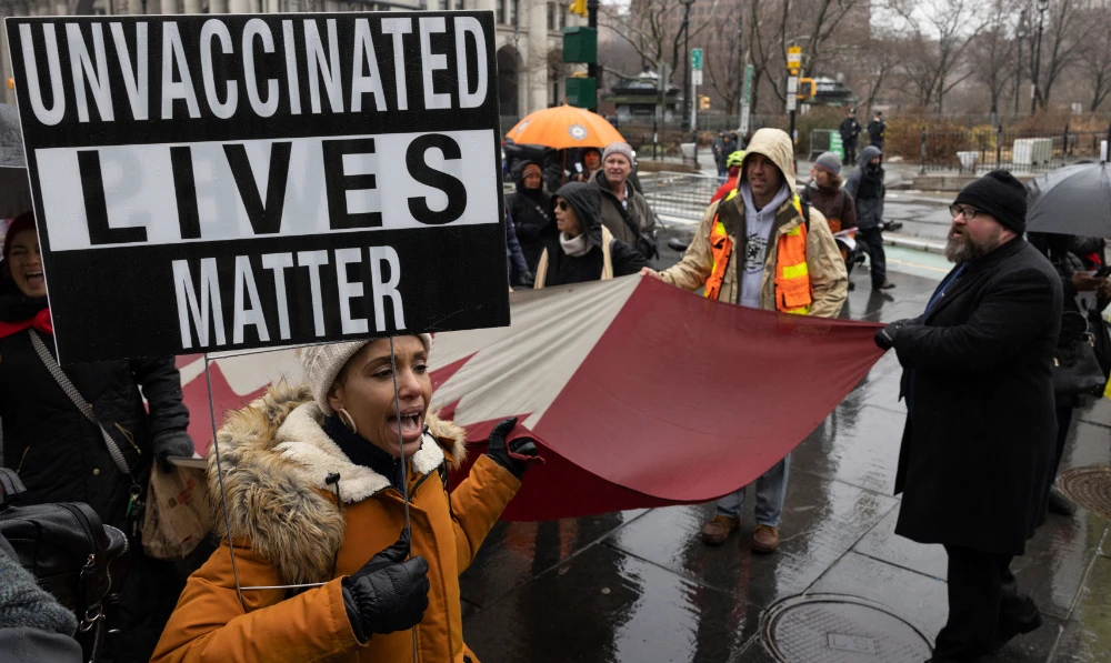 A person holds a sign during the anti-vaccine mandate protest ahead of possible termination of New York City employees due to their vaccination status in New York. (AP/File)