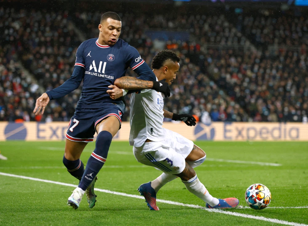 Paris St Germain's Kylian Mbappe in action with Real Madrid's Eder Militao during their Champions League, round of 16, first leg soccer match, in Paris, France, Tuesday, Feb. 15, 2022. (Reuters)