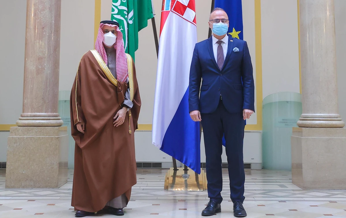 Saudi Foreign Minister Prince Faisal bin Farhan greets Gordan Grlic-Radman, Croatia’s minister of foreign and European affairs. (SPA)