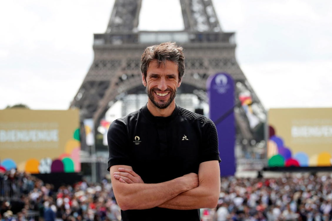 Paris 2024 Olympics Organizing Committee President Tony Estanguet poses in front of the Eiffel Tower as people gather at Paris’ Olympics fan zone to watch the closing ceremony of the Tokyo games in August 2021. (Reuters)