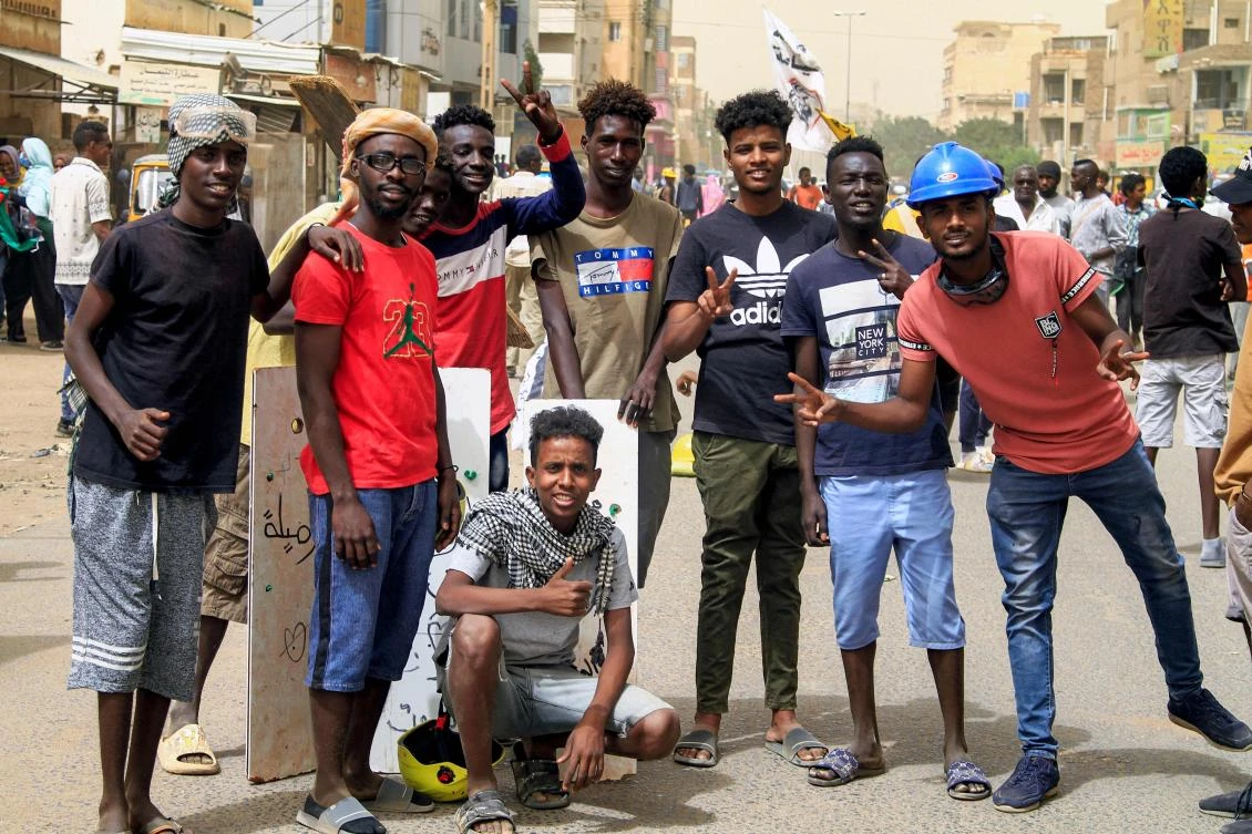 Demonstrators pose for a group photo during ongoing protests calling for civilian rule and denouncing the military administration, Sahafa neighborhood, in the south of Sudan’s capital Khartoum, Feb. 20, 2022. (AFP)