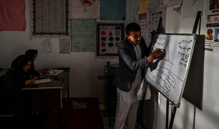 This picture taken on November 14, 2021 shows a teacher inside a classroom at a secondary school in Nawabad village, in Qarabagh district near Ghazni province, Afghanistan. (AFP/FILE)