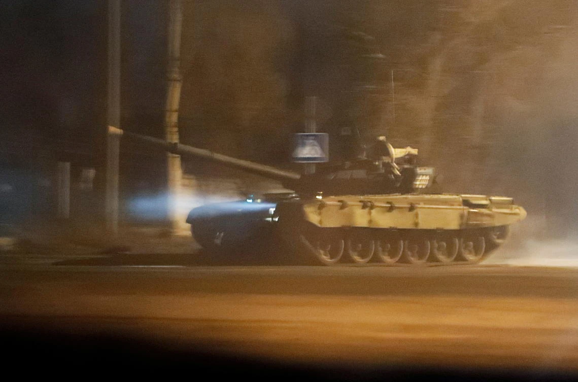 A Russian tank drives along a street of the separatist-controlled city of Donetsk, Ukraine on Tuesday. (Reuters)