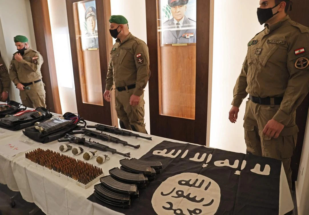 ISF show weapons the ministry of interior said were seized from the Daesh group which was planning attacks on targets in Beirut's southern subrubs, during a press conference in the Lebanese capital on February 23, 2022. (AFP)