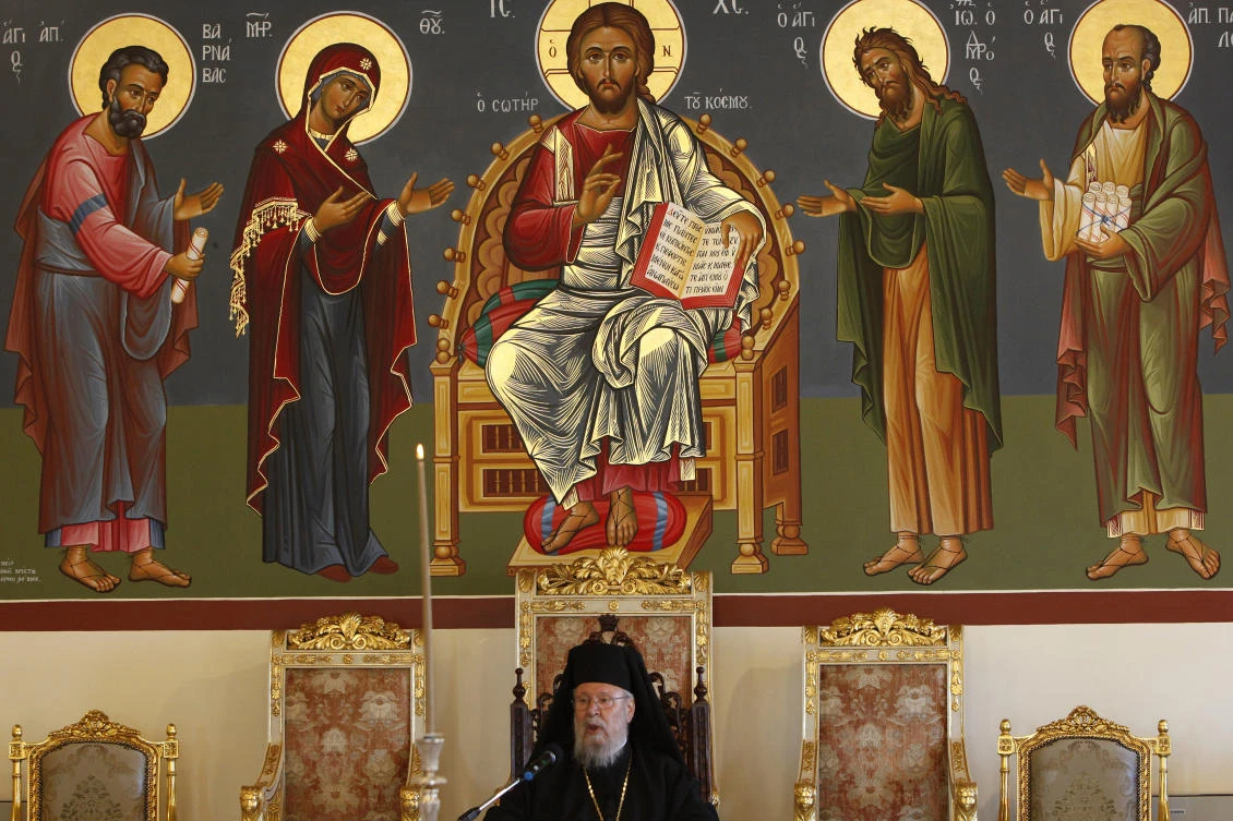 A representative of the Cyprus Archbishop Chrysostomos II received the icon during a ceremony on Wednesday. The son of the British officer, who found the icon during a 1974 Turkish invasion, said it remained locked away. (AP)