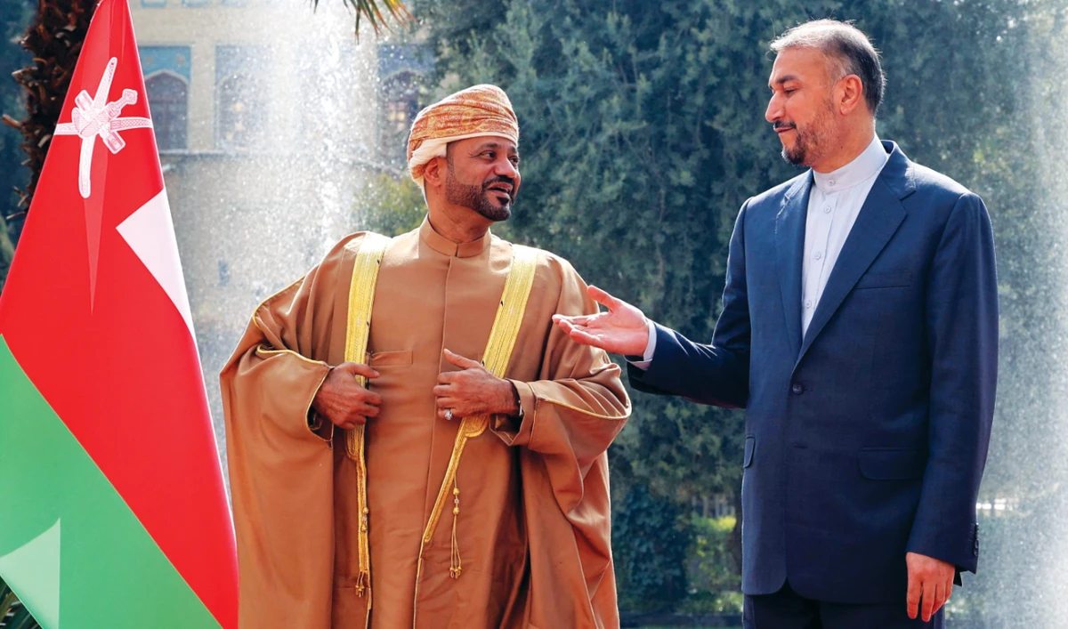 Iranian Foreign Minister Hossein Amir-Abdollahian welcomes his Omani counterpart Sayyid Badr Al-Busaidi in Tehran on Wednesday. (AFP)