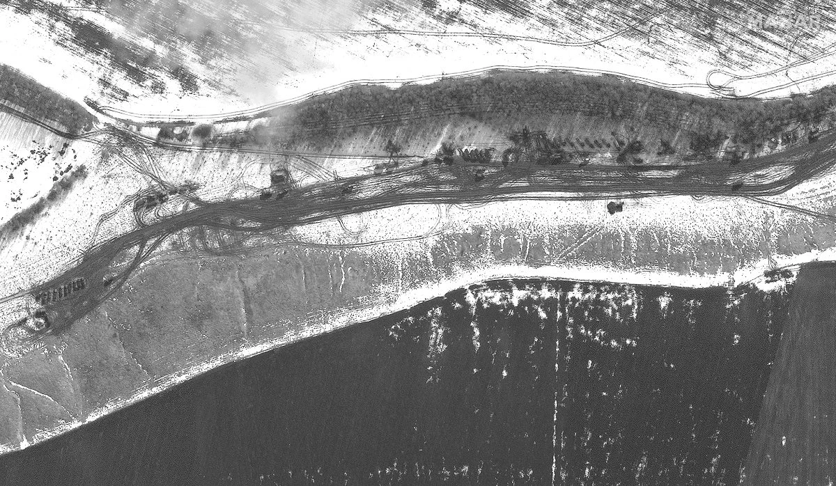 This satellite image provided by Maxar Technologies on Feb. 23, 2022, shows artillery, troops and logistics deployment near the town of Malakeevo, northeast of Valuyki, Russia, close to the border with Ukraine. (AP)