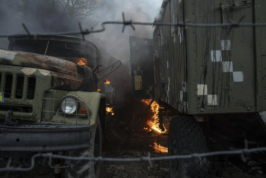 Ukrainian military equipment burns at an air defense base, in the aftermath of a Russian strike, in Mariupol, Ukraine, Thursday, Feb. 24, 2022. (AP Photo)