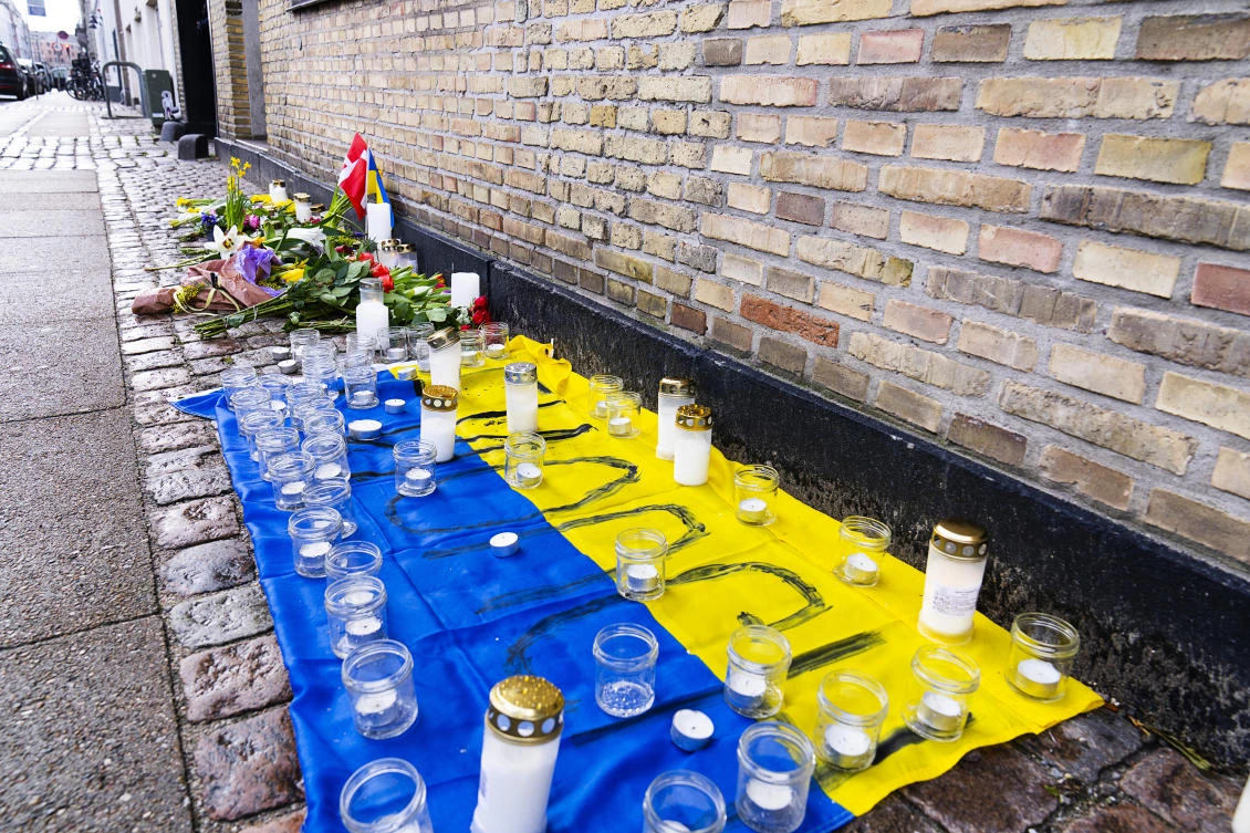 Flowers and candles were left in front of the Ukrainian Embassy in Copenhagen on Friday. (AP)