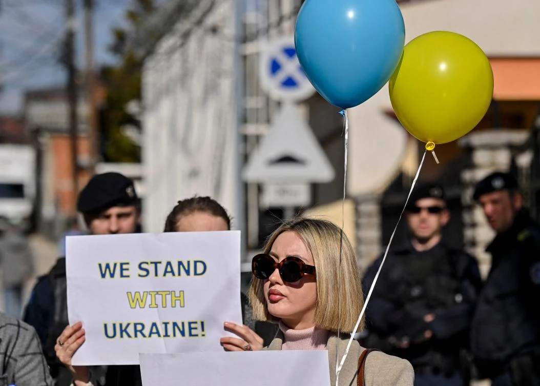 Demonstrators protest against the Russian invasion of Ukraine, in front of the Russian representative office in Pristina, Kosovo, Feb. 25, 2022. (AFP)