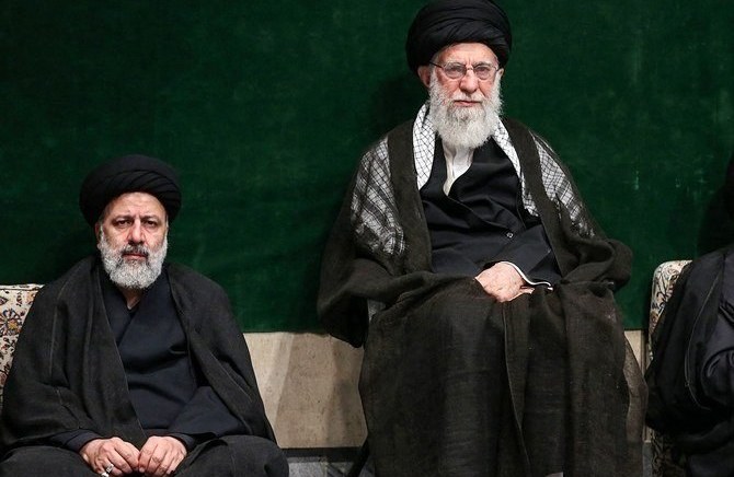 President of Iran Ebrahim Raisi, left, with Supreme Leader Ayatollah Ali Khamenei. (AFP)