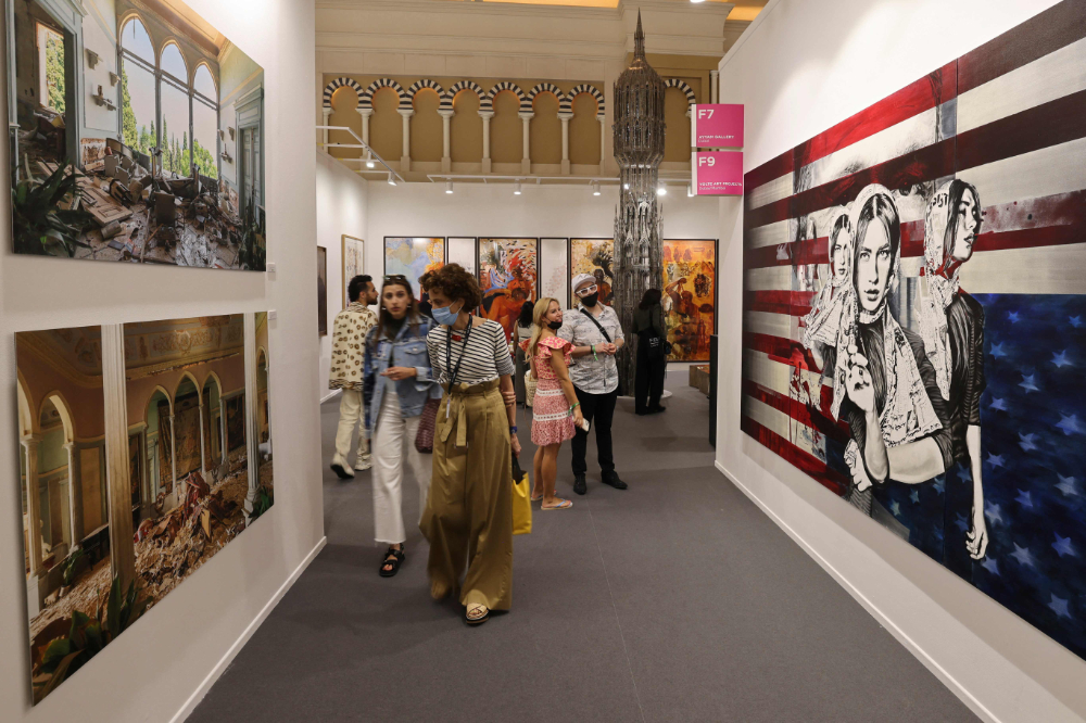 People visit the 15th edition of Art Dubai at Madinat Jumeirah in the Gulf emirate of Dubai, on March 10, 2022. (AFP)