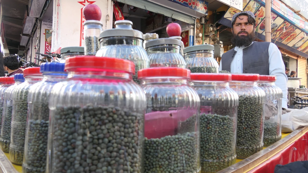 Sharaf ud Din, a local shinay vendor, stands in Liaquat Bazar to sell the dry fruit in Quetta, Pakistan, on February 19, 2022. (AN photo)