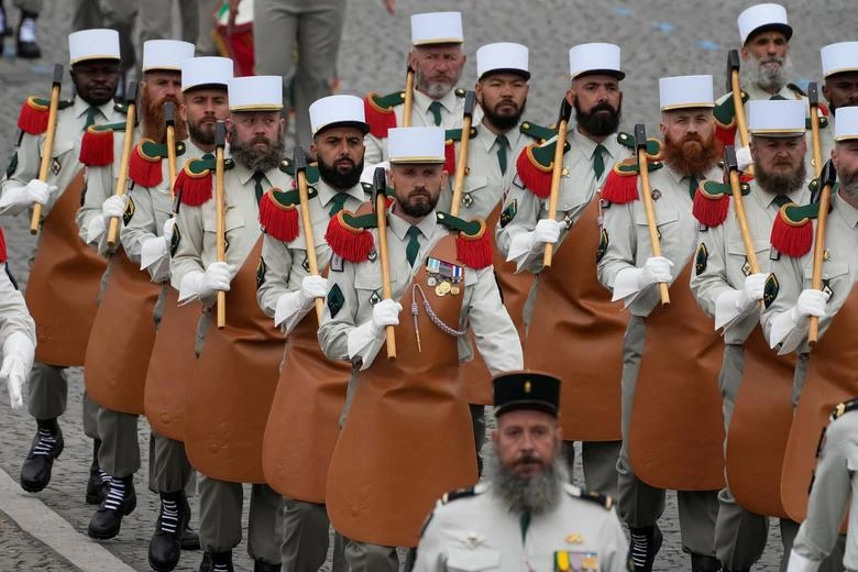 Soldiers of the French Foreign Legion march on the Champs-Elysees avenue during the Bastille Day parade in Paris, France, July 14, 2021. (Reuters)