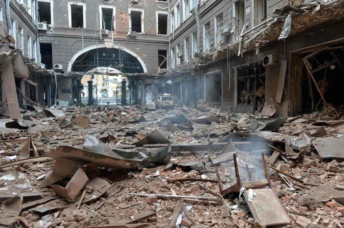 A picture shows damage caused to a building by Russian shelling of Constitution Square in Kharkiv on March 2, 2022. (AFP)