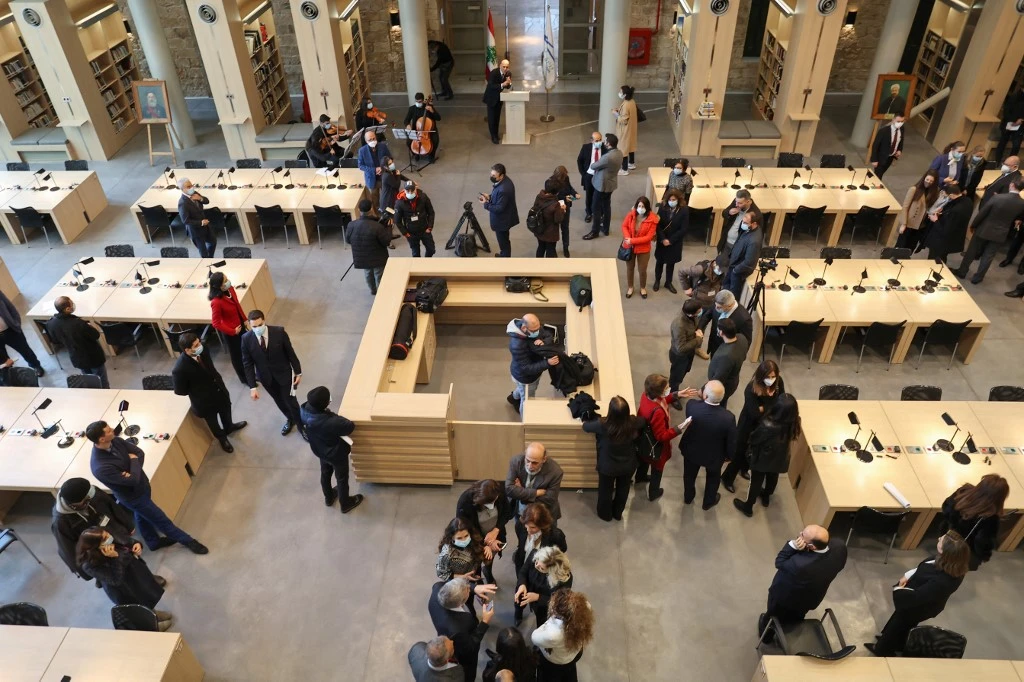 People attend the reopening ceremony of Lebanon’s National Library in Beirut on Feb. 10, 2022, upon completion of restoration work in the aftermath of the summer 2020 port explosion. (AFP)
