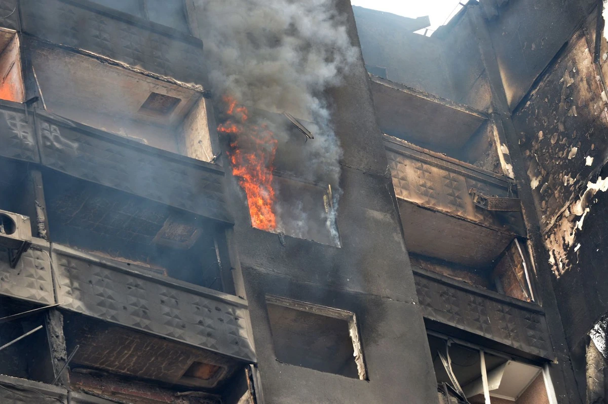 A building burns after Russian troops shelled the area in the second largest Ukrainian city of Kharkiv, in the east on March 6, 2022. (AFP)